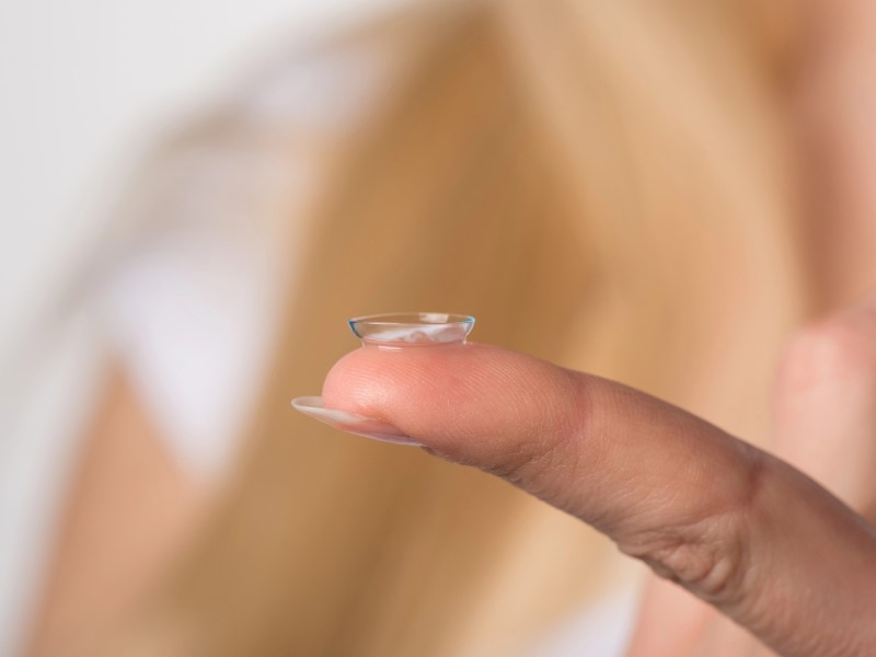 a close-up of a finger with a contact lens