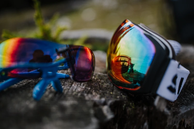 a pair of sunglasses on a log